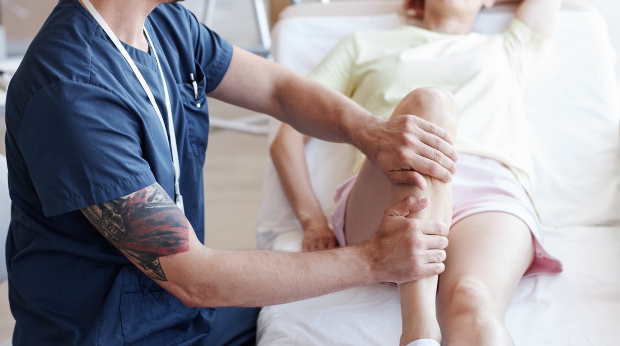 Massagist doing massage to patient